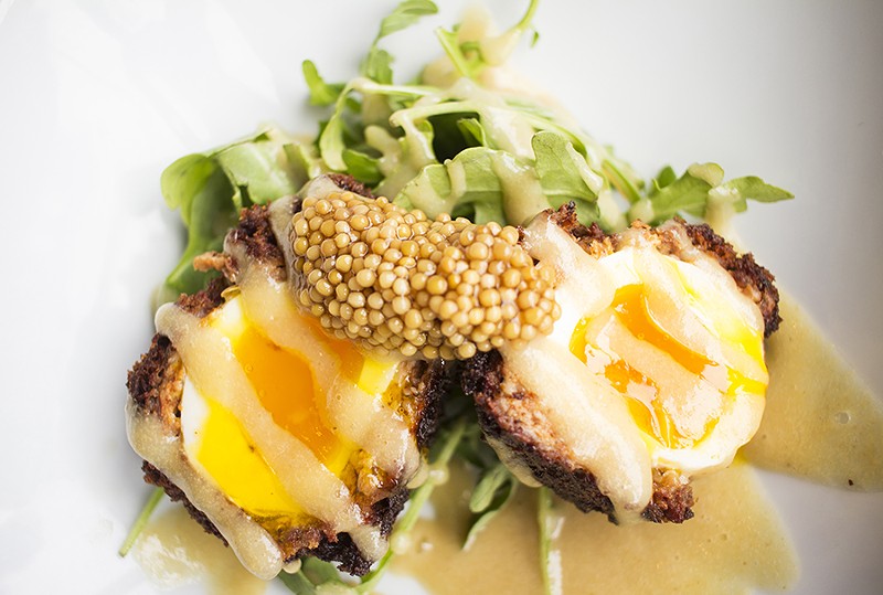 The Scotch egg, served with pickled mustard-seed vinaigrette and arugula, is a standout. - PHOTO BY MABEL SUEN