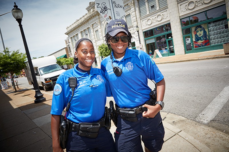 St. Louis Metropolitan Police officers Jazmon Garrett and Devin Jackson work the beat on Cherokee, trying to build relationships with residents. - PHOTO BY STEVE TRUESDELL