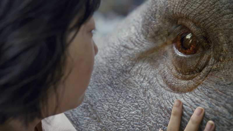 On the surface, Okja is a post-E.T. story of a child and her non-human friend, - (C) NETFLIX