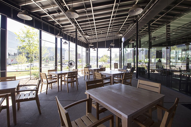 A large enclosed patio provides additional seating. - MABEL SUEN