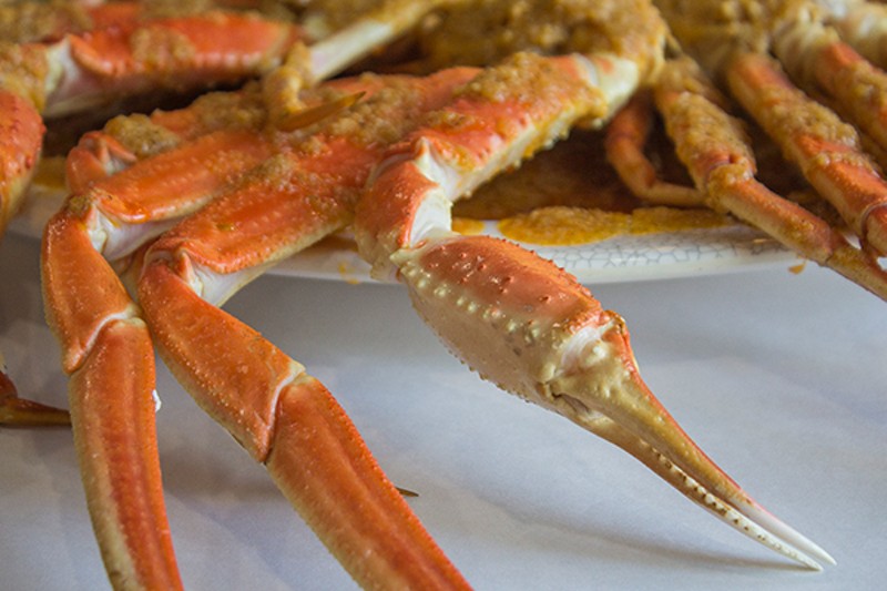 Crab legs, coated in seasoning. - PHOTO BY SARA BANNOURA