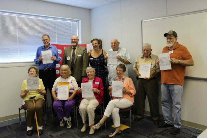 Eight pre-1941 adoptees were able to receive their birth certificates in August 2016 thanks to a new Missouri law. State Rep. Don Phillips is in the back. - COURTESY OF PATTI NAUMANN