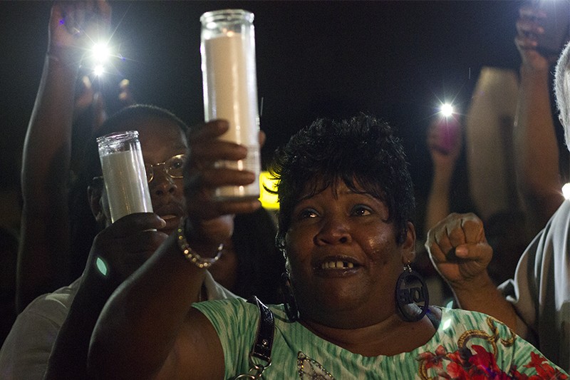 Annie Smith at a candlelight vigil for her son Monday night. - PHOTO BY DANNY WICENTOWSKI