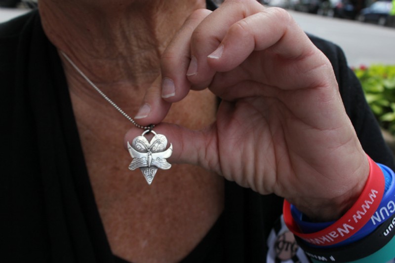 Pat Maisch wears a butterfly necklace in honor of Christina Taylor Green, 6, who was killed in the Tucson mass shooting. - PHOTO BY DOYLE MURPHY