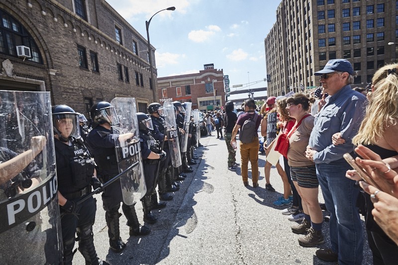 Protesters face off in downtown St. Louis yesterday after the acquittal of a former city cop. - PHOTO BY THEO WELLING