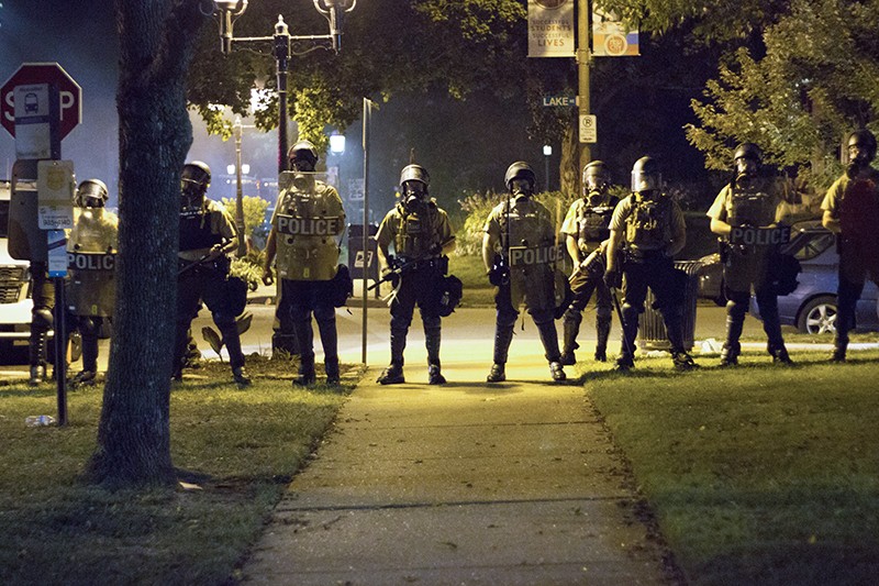 Before deploying tear gas, St. Louis cops in riot gear assembled at the intersection of Waterman Boulevard and Lake Avenue, about a block from Lyda Krewson's house. - PHOTO BY DANNY WICENTOWSKI