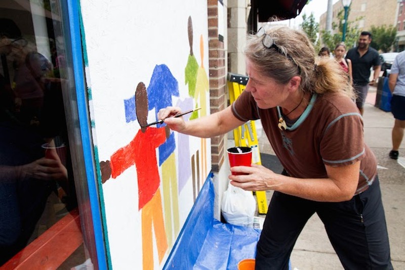 Artist Sophie Binder works at Meshuggah. - COURTESY OF PAINTING FOR PEACE IN FERGUSON, A CHILDREN'S BOOK