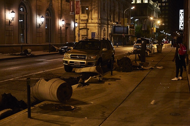 Broken flowerpots show the destruction downtown in the late night of Sunday, September 17. - PHOTO BY THEO WELLING