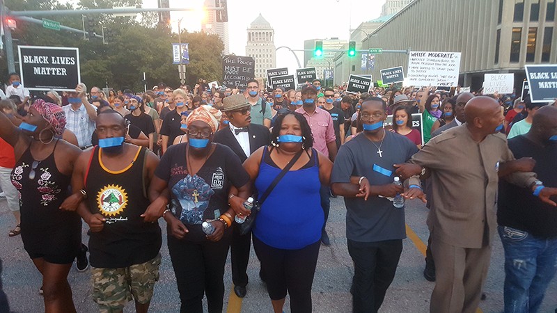 Annie Smith, the mother of the late Anthony Lamar Smith, is at center of a protest through downtown St. Louis on September 25. - PHOTO BY DANNY WICENTOWSKI