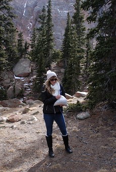 Sarah Plank on Pikes Peak, preparing to scatter the remains of Chief Wana Dubie to the wind.