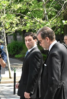 Steve Stenger (left) leaves the federal courthouse on Monday with his attorney, Scott Rosenblum.