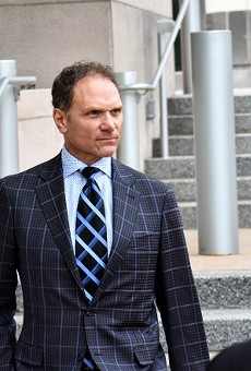 John Rallo went full power tie for his arraignment in May.