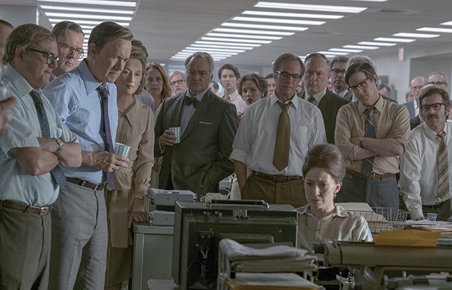 The editorial staff of The Washington Post gathers around the TV to watch the nation respond to its work.