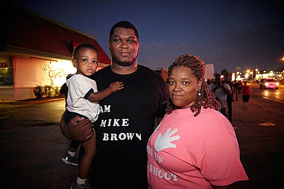 A family joins Ferguson protesters nine days after the death of Michael Brown. - STEVE TRUESDELL