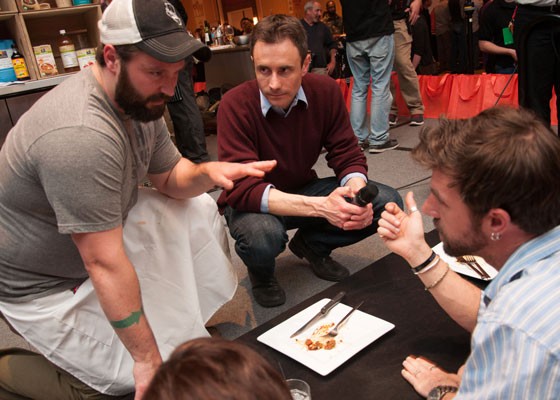 Chef Ed Heath, with RFT editor-in-chief Chad Garrison, presents his dish to the judges at Iron Fork 2014. | Micah Usher