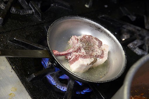 Missouri raised Berkeley Pork is seared before baking for the Newman Pork Chop. See more photos from Molly's in our slideshow. - PHOTO: STEVE TRUESDELL