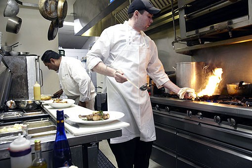 Chefs Mike and Julio performing their art in Molly's kitchen. See more photos from Molly's in our slideshow. - PHOTO: STEVE TRUESDELL