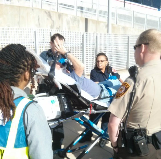 Above, a man suspected of drunkenly causing an altercation on the Blue Line is finally taken away by EMS at the Shrewsbury station. - PHOTO COURTESY OF A METROLINK PASSENGER