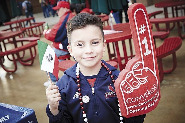 A young Cardinals' fan shows off his Mexican pride at "Fiesta Cardenales." - PHOTO BY STEVE TRUESDELL