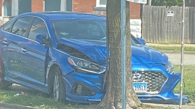 A Hyundai Sonata sits abandoned after being crashed into a tree in St. Louis city.