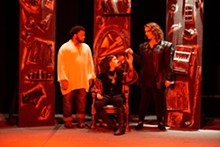 JOEY RUMPELL - Faustus (Ashley Bauman, center) heeds the Seven (Nicole Angeli, left) while her former tormentor (Kareem Deanes, right) awaits his fate.