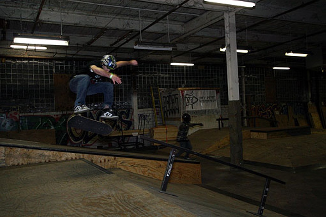 A skateboarder flips his board up a gap during practice.