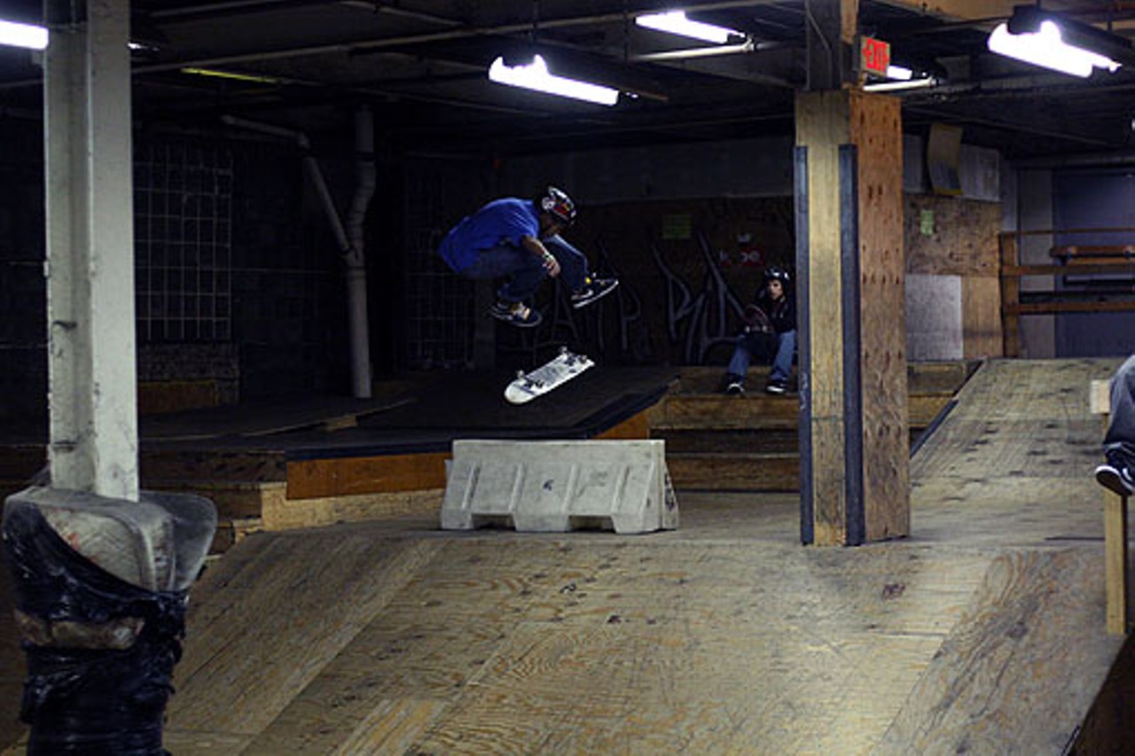 A skateboarder flips his board over an obstacle during the singles intermediate session. After jam sessions each skateboarder from each level are given one minute to show their best tricks.