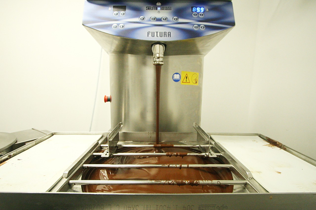 After the chocolate is developed, it&rsquo;s then aged for one to two months for flavor development. Once aged, the chocolate can then be transferred to the tampering machine and depositor, where chocolate bar molds are filled.