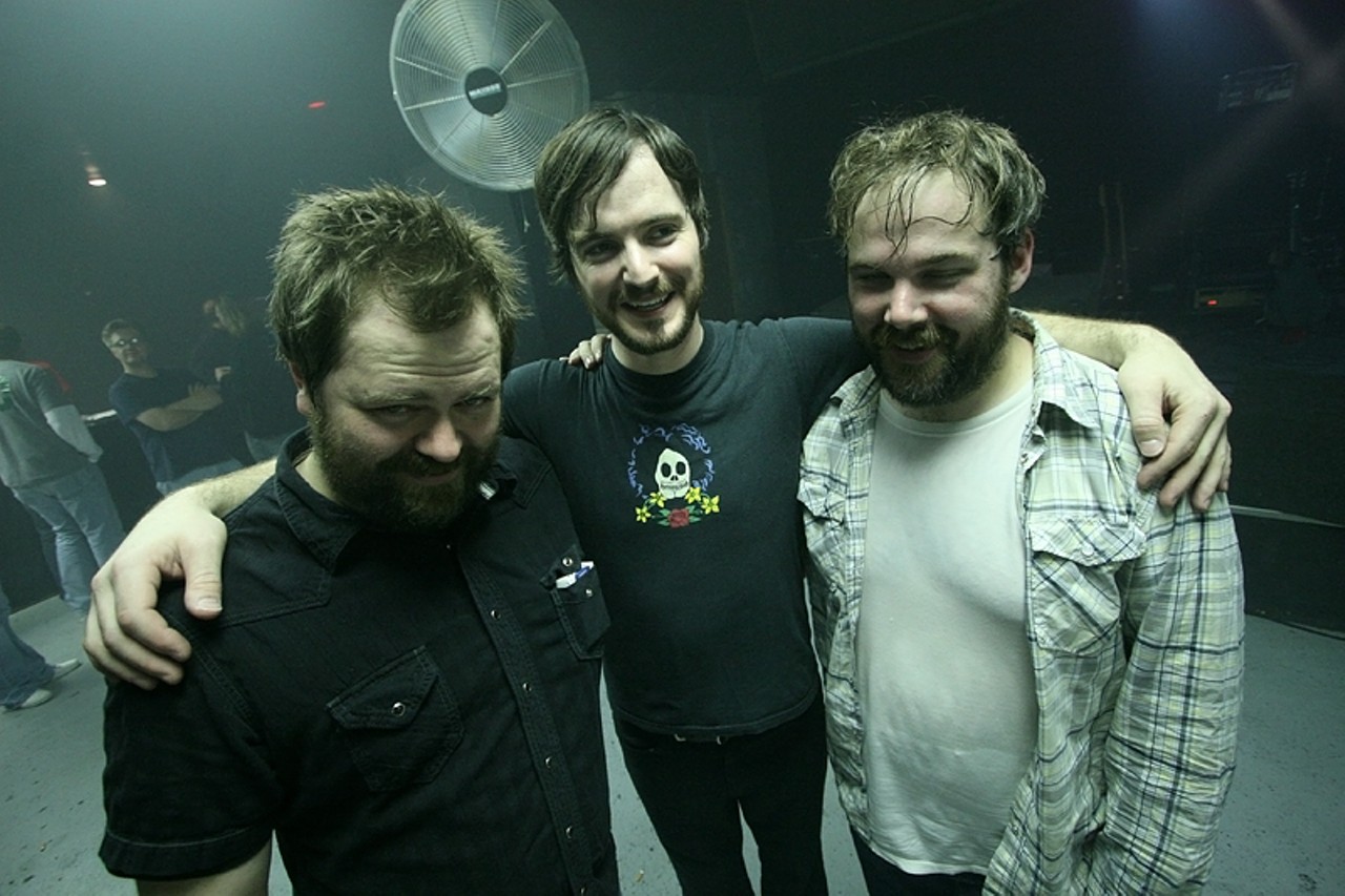 Jimmy Vavak, Andrew Elstner, and Rob Smith of Riddle of Steel pose for one last photo as a band after the show.