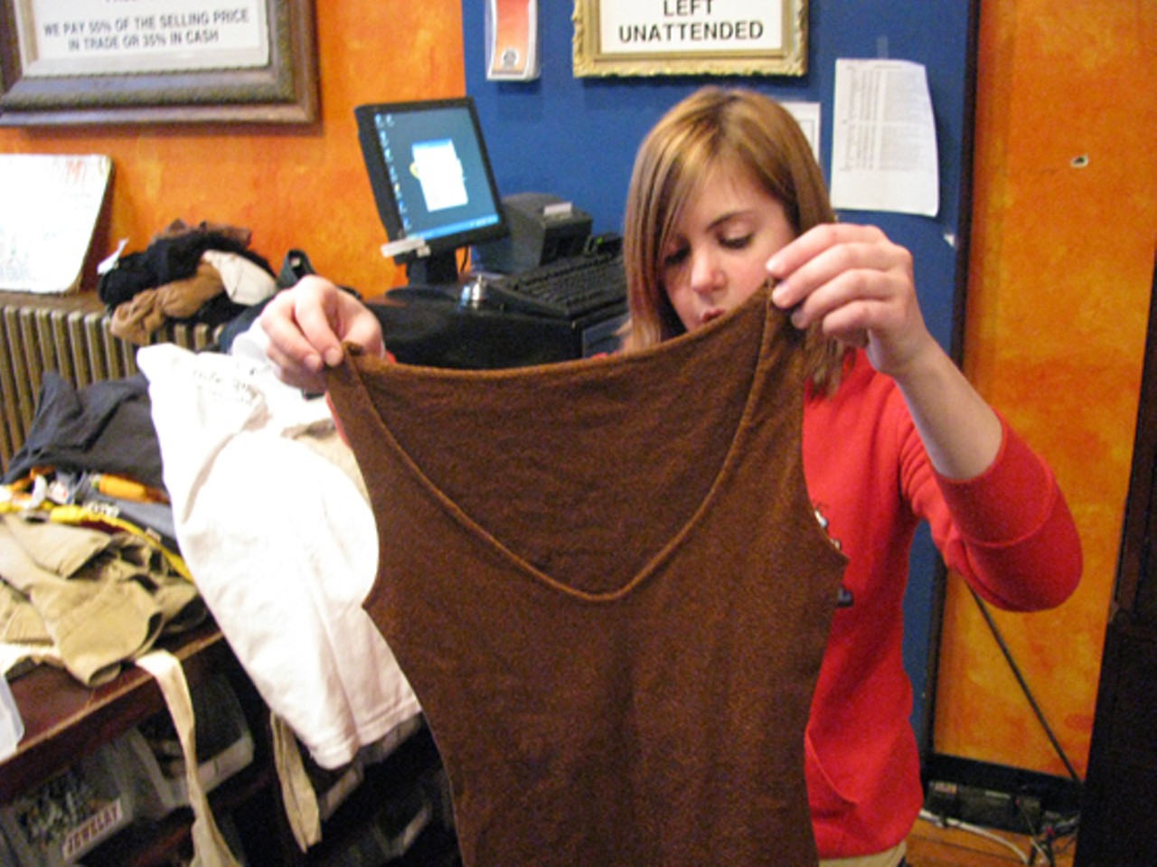 This brown tank-top's also going back home.