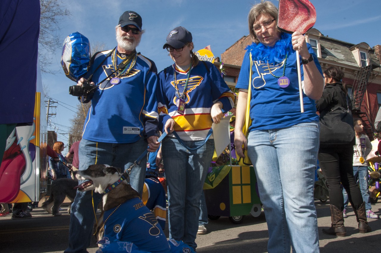 Mark Edghill, Bridgette Edghill, Mary Helen and Penny the pup all decked out in Blues gear.