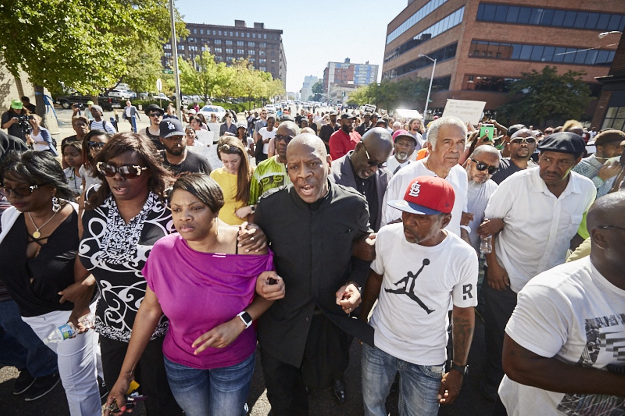 Activist Anthony Shahid kicks off a march of protesters at Market and Tucker earlier this morning.