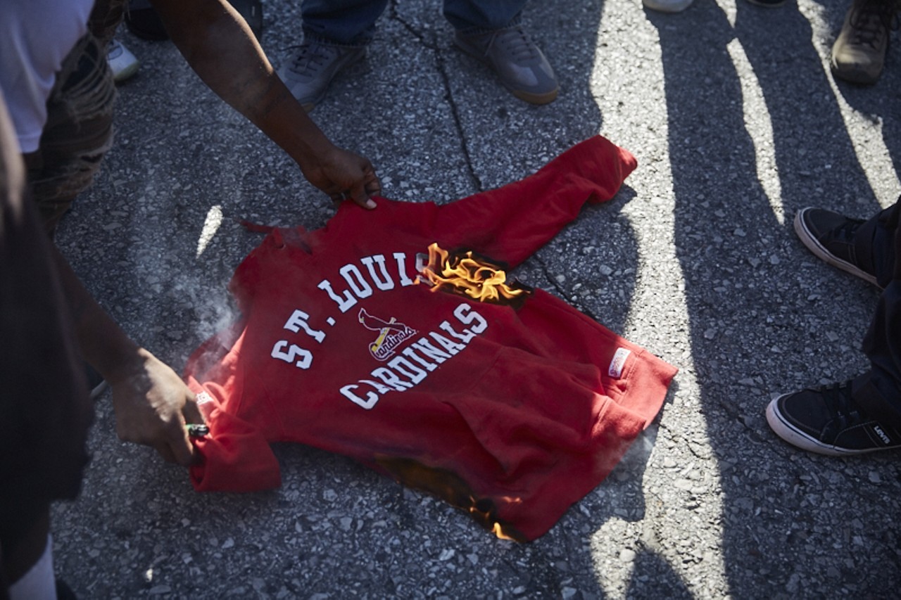 Protesters burned a Cardinals sweatshirt.