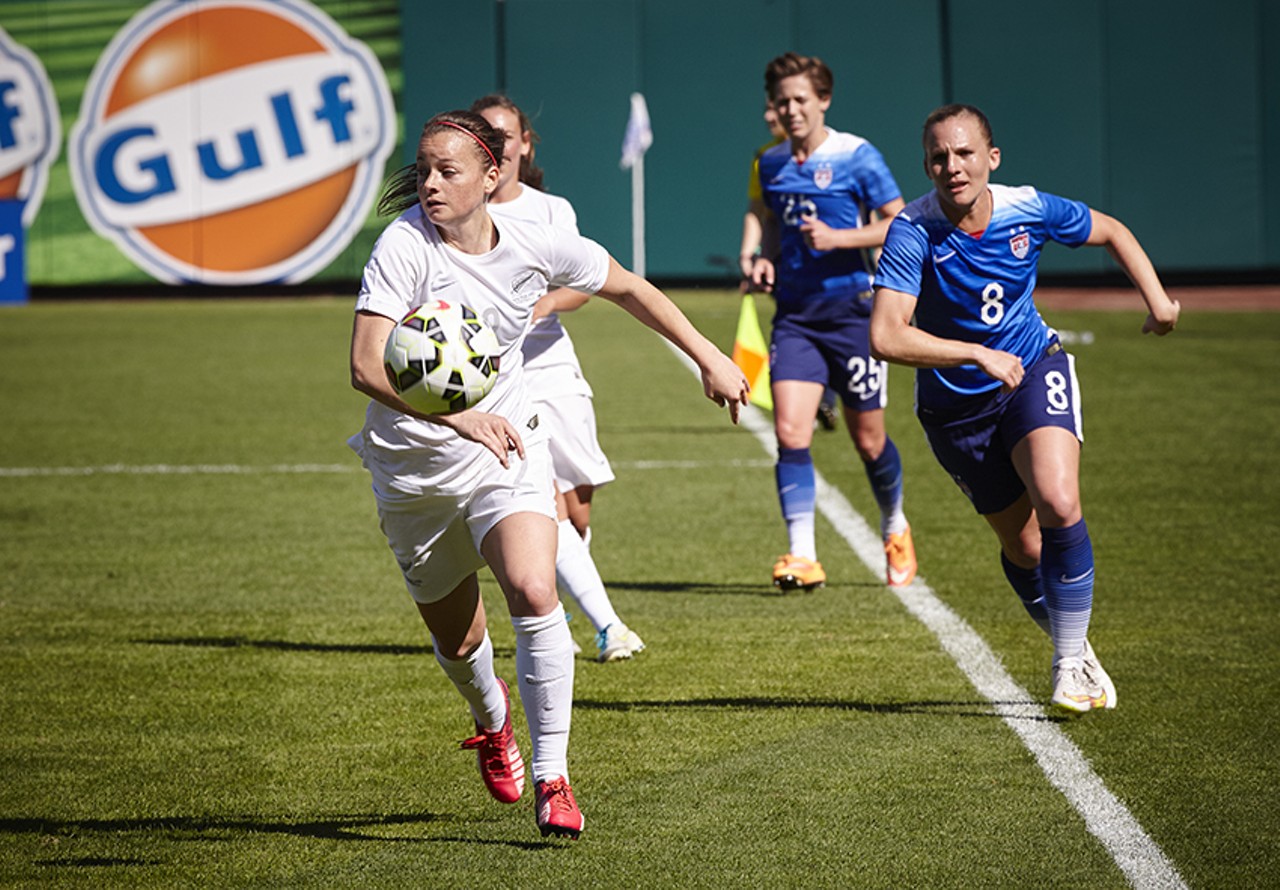 Amy Rodriguez chases down a New Zealand player.
