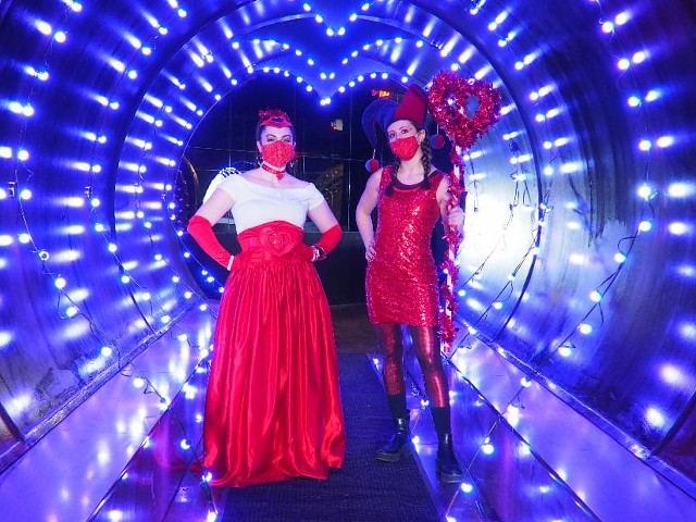 Two women stand in the Tunnel of Love.