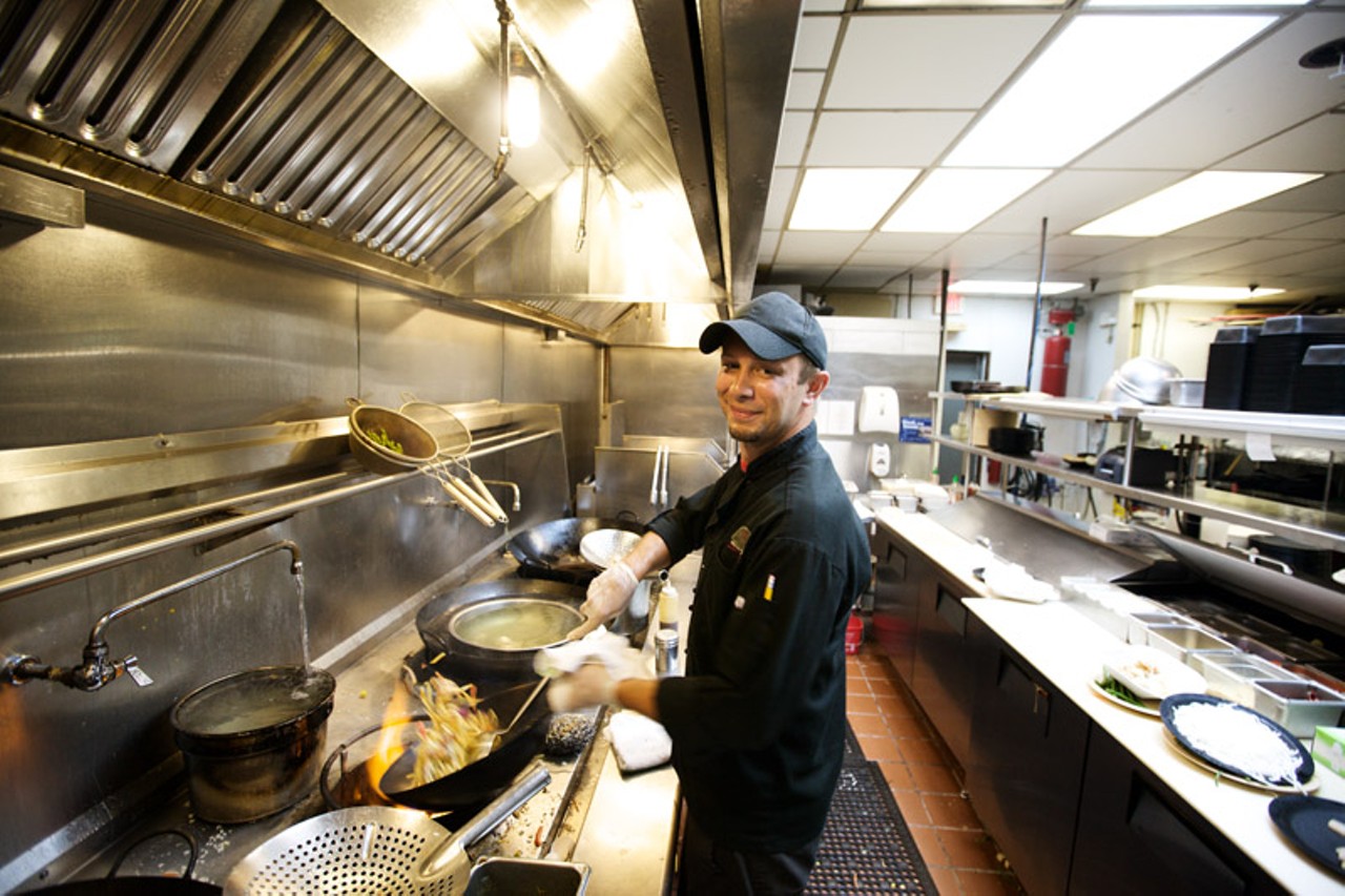 Head Chef and VP of Operations Charles Hammelman at work in the kitchen of Wang Gang Asian Eats in St. Charles.