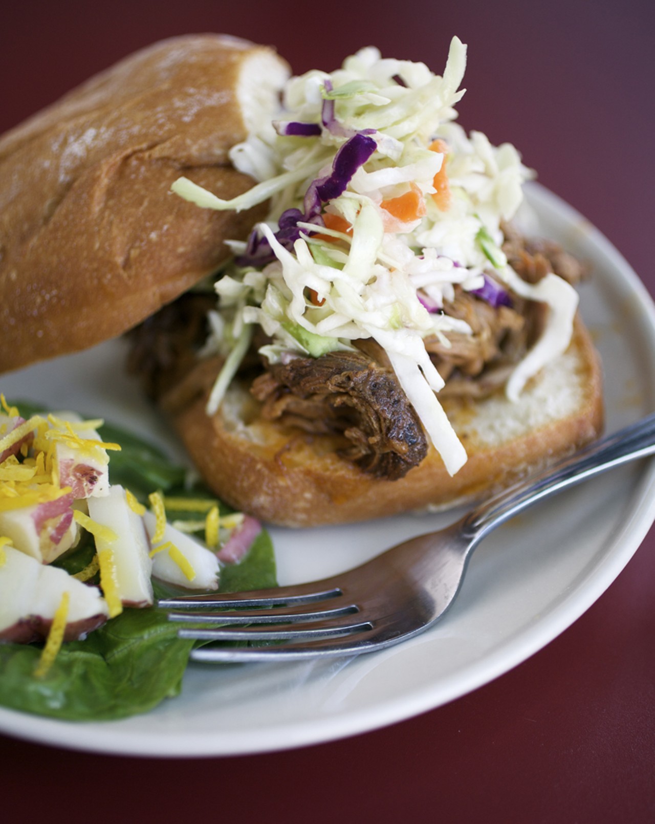 The beer brisket sandwich is served with coleslaw and citrus potato salad.
