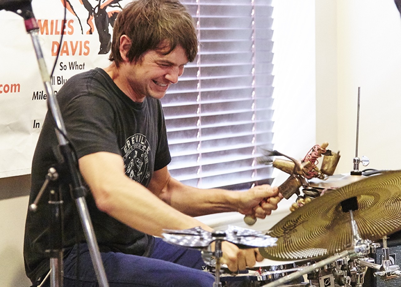 Glen Kotchke plays with his unusual drum sticks.