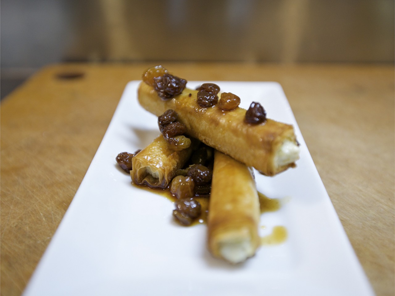 Cabrales Cigars are Spanish blue cheese and leek fondue, rolled into phyllo &ldquo;cigars&rdquo; and then baked and drizzled with sherry-raisin dipping sauce.