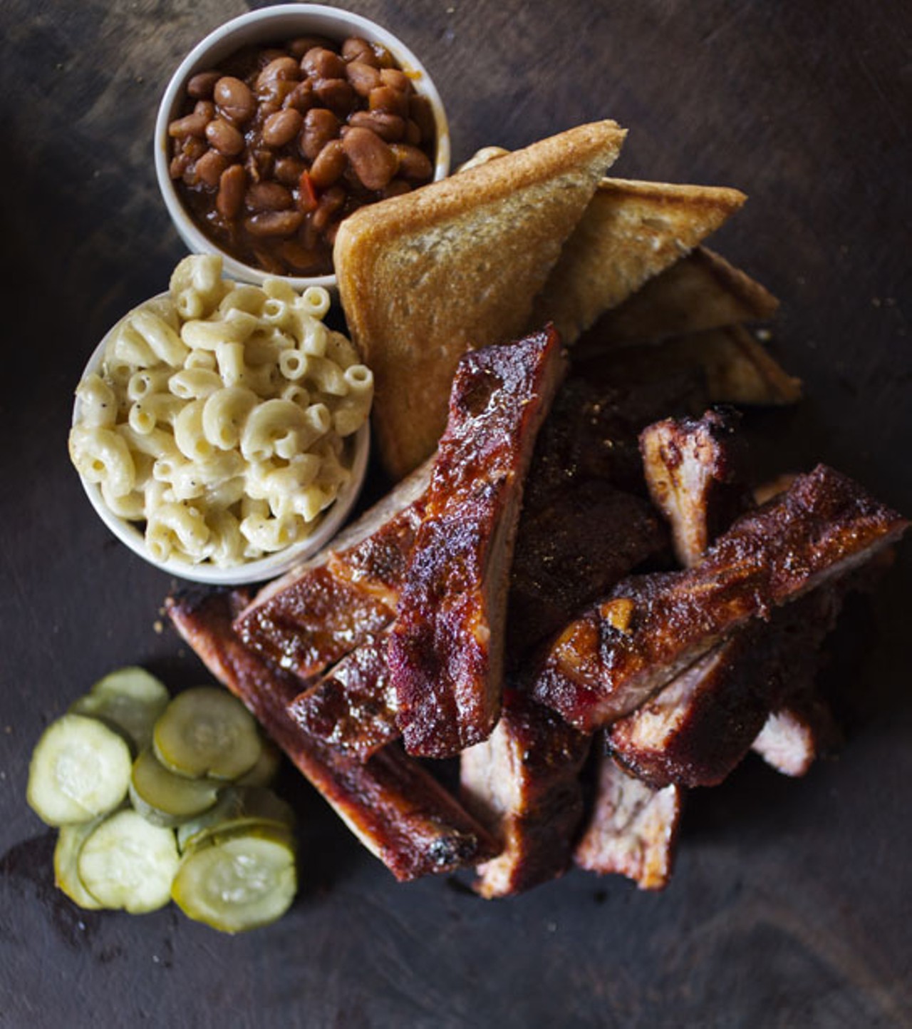 The smoked baby-back ribs are dry rubbed. Here, they're shown with the five-cheese mac & cheese and root-beer-baked beans.