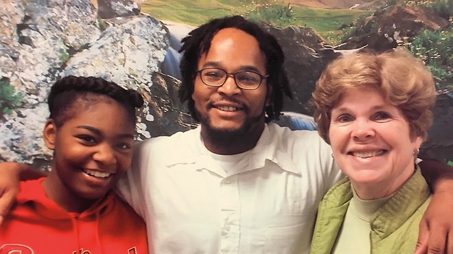 Khorry Ramey (left) and Kevin Johnson (center) and Johnson's elementary school principal Pamela Stanfield (right).