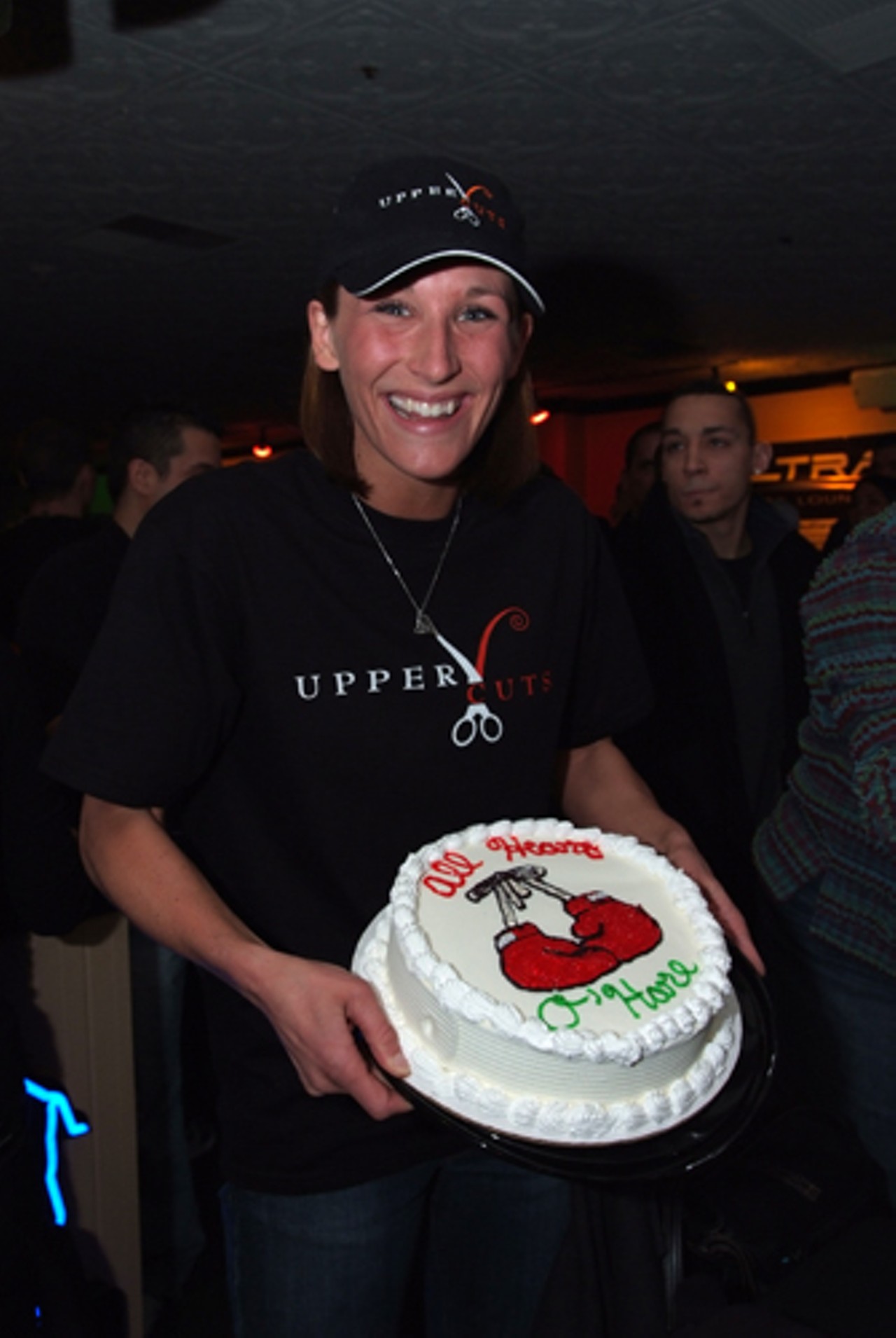 O'Hare shows off her 10-inch Dairy Queen ice cream cake. It's a post weigh-in tradition to gorge on the cake after shaving pounds to make the 150-pound weight limit.