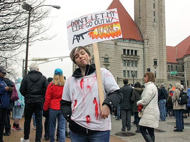 A student protests gun violence at St. Louis' March for Our Lives.
